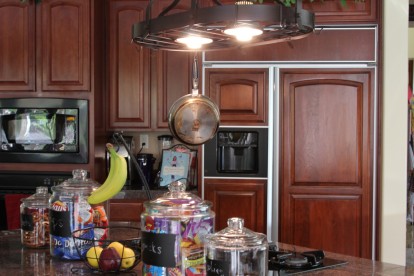 intalled hanging lighted pot rack with GE Reveal Light Bulbs